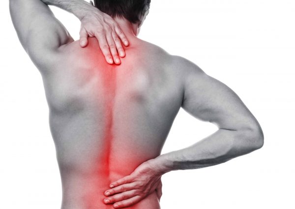 Man with pain in his back over white background